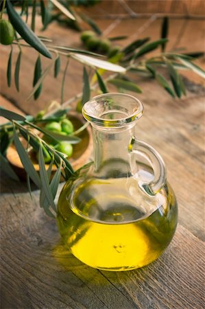 eating olive - Extra virgin healthy Olive oil with fresh olives on rustic wooden background Stock Photo - Budget Royalty-Free & Subscription, Code: 400-05381635