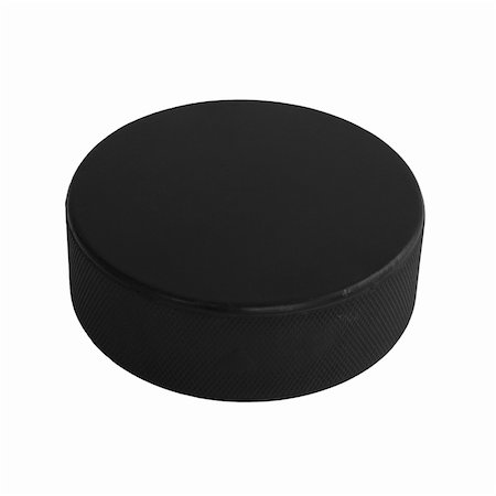 An isolated hockey puck laying flat over a white background. Stock Photo - Budget Royalty-Free & Subscription, Code: 400-05381940