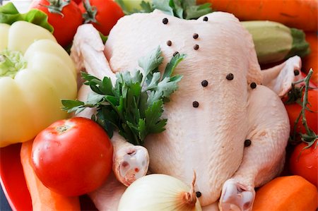 Chicken raw  with vegetables Foto de stock - Super Valor sin royalties y Suscripción, Código: 400-05382236