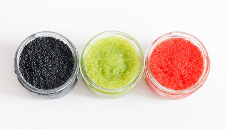 the red, green and black caviar in glass jars on withe background Foto de stock - Super Valor sin royalties y Suscripción, Código: 400-05382248