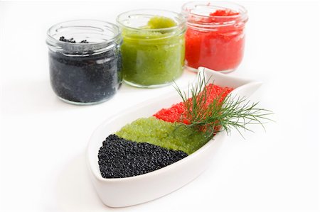 caviar in a bowl-shaped over on withe background Foto de stock - Super Valor sin royalties y Suscripción, Código: 400-05382251