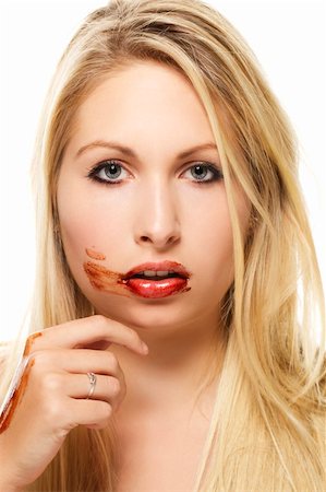beautiful blonde woman after eating chocolate on white background Stockbilder - Microstock & Abonnement, Bildnummer: 400-05383019