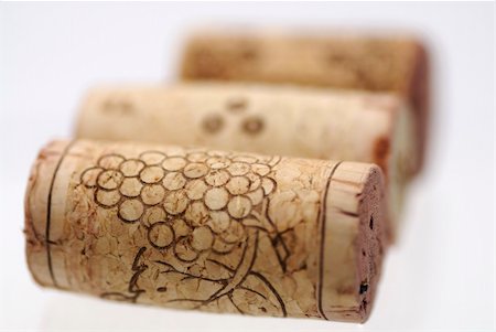 simsearch:400-05383095,k - Simple studio shot of three wine corks. Focus on 1st cork, shallow DOF. Stockbilder - Microstock & Abonnement, Bildnummer: 400-05383096