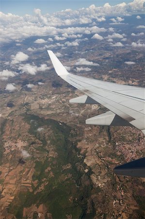 Airplane Wing view from Window during Flight Stock Photo - Budget Royalty-Free & Subscription, Code: 400-05383125