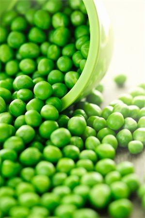 Closeup on spilling bowl of fresh green green peas Stock Photo - Budget Royalty-Free & Subscription, Code: 400-05383419