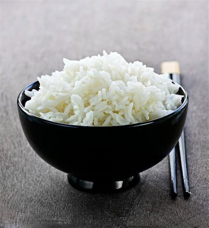 steamed rice - White steamed rice in black round bowl with chopsticks Stock Photo - Budget Royalty-Free & Subscription, Code: 400-05383421