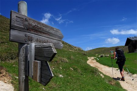 simsearch:400-07315693,k - Tourist sign int he mountains with hiker in the background Stock Photo - Budget Royalty-Free & Subscription, Code: 400-05383587