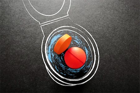 Pills in toilet on black background Stock Photo - Budget Royalty-Free & Subscription, Code: 400-05383946