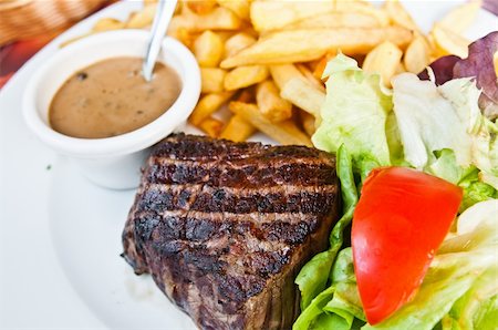 simsearch:400-05664697,k - juicy steak beef meat with tomato and french fries Stock Photo - Budget Royalty-Free & Subscription, Code: 400-05665646