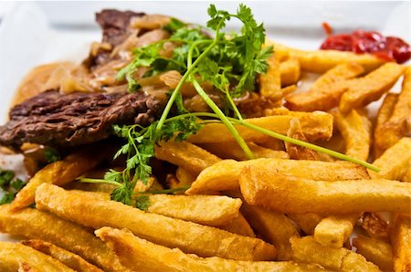 simsearch:400-05664697,k - juicy steak beef meat with tomato and french fries Stock Photo - Budget Royalty-Free & Subscription, Code: 400-05665653