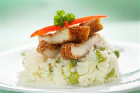 fried chicken plate - Chicken fried with eggs and bread crumbles and served with peas risotto Stock Photo - Budget Royalty-Free & Subscription, Code: 400-05666501