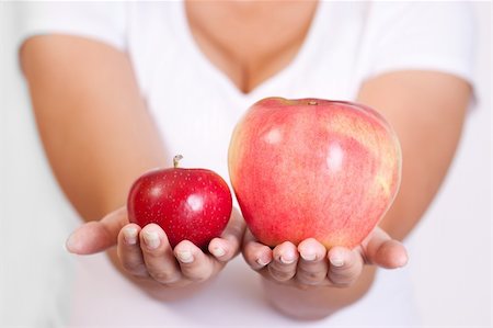 Fresh red apples in a woman hand Stock Photo - Budget Royalty-Free & Subscription, Code: 400-05666533