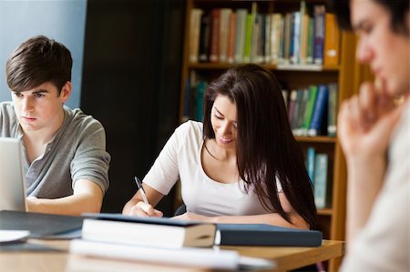 simsearch:400-06557512,k - Students working on an essay in the library Photographie de stock - Aubaine LD & Abonnement, Code: 400-05668902