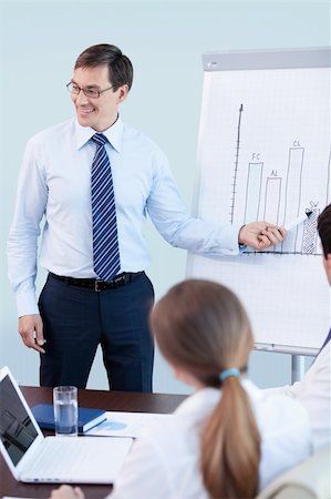 simsearch:400-05669026,k - A man shows a presentation at the office Stock Photo - Budget Royalty-Free & Subscription, Code: 400-05669033