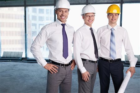 Business people in hard hats at construction site Stock Photo - Budget Royalty-Free & Subscription, Code: 400-05669055