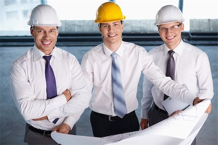 Business people in hard hats at construction site Stock Photo - Budget Royalty-Free & Subscription, Code: 400-05669056