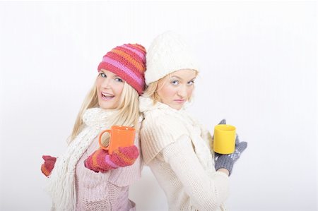 Two pretty happy winter girls friends drinking hot tea Stock Photo - Budget Royalty-Free & Subscription, Code: 400-05669080