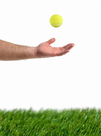 Sporting tennis balls on artificial green grass Stock Photo - Budget Royalty-Free & Subscription, Code: 400-05669452