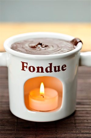 flaming pudding - Delicious melted chocolate in ceramic fondue pot Stock Photo - Budget Royalty-Free & Subscription, Code: 400-05669584