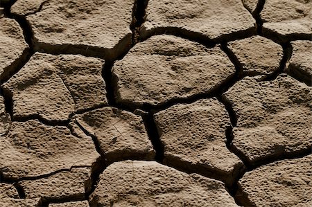 simsearch:400-05292342,k - Cracked by the heat long lifeless soil Stock Photo - Budget Royalty-Free & Subscription, Code: 400-05663204