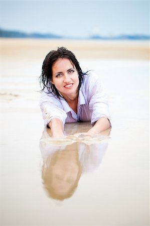 stain on shirt - Sexy Woman lying in water Stock Photo - Budget Royalty-Free & Subscription, Code: 400-05663524