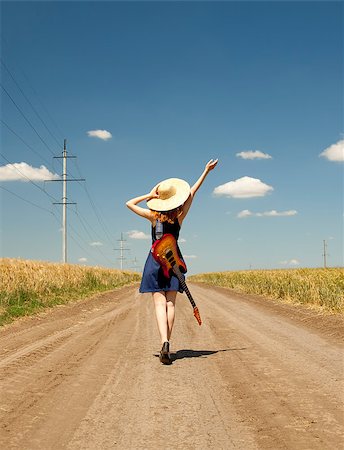 Rock girl with guitar at countryside. Stockbilder - Microstock & Abonnement, Bildnummer: 400-05663693