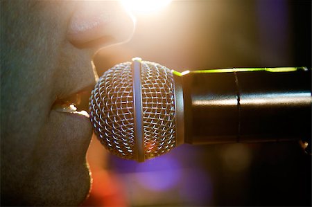 Close up image of singer and microphone on stage Foto de stock - Super Valor sin royalties y Suscripción, Código: 400-05663885