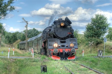 Old retro steam train passing through polish countryside Stock Photo - Budget Royalty-Free & Subscription, Code: 400-05674064