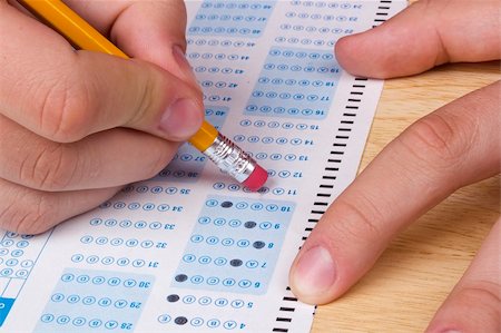 pencils and eraser - Student erasing a mistake he made on a test. Stock Photo - Budget Royalty-Free & Subscription, Code: 400-05674375