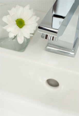 Closeup of modern bathroom tap Stockbilder - Microstock & Abonnement, Bildnummer: 400-05674411