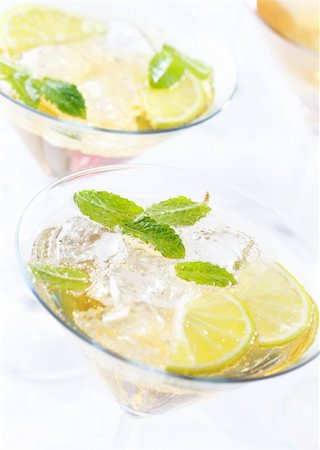 Cocktails or longdrinks garnished with fruits Stock Photo - Budget Royalty-Free & Subscription, Code: 400-05674534