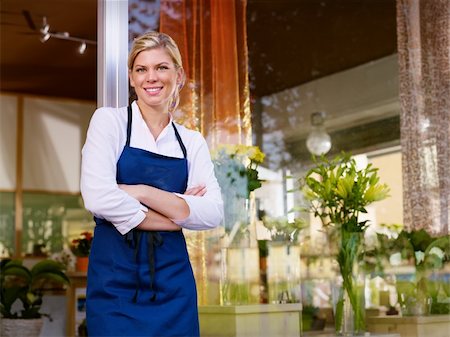 flower sale - Portrait of beautiful caucasian girl self-employed in flower shop, smiling and looking at camera. Horizontal shape, waist up Stock Photo - Budget Royalty-Free & Subscription, Code: 400-05674607