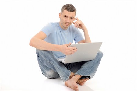 study online at home - handsome young male study on laptop computer. isolated Stock Photo - Budget Royalty-Free & Subscription, Code: 400-05674601