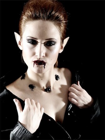 face female mystery - Terrible fashion vampire woman with spiders and blood Stock Photo - Budget Royalty-Free & Subscription, Code: 400-05674710