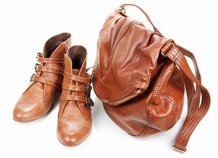 simsearch:622-02355174,k - Brown leather bag and pair feminine boots on white background Photographie de stock - Aubaine LD & Abonnement, Code: 400-05674767