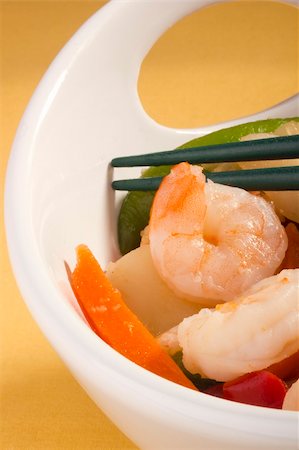 simsearch:400-05745083,k - Asian salad in a white bowl with green chopsticks. Fotografie stock - Microstock e Abbonamento, Codice: 400-05675394