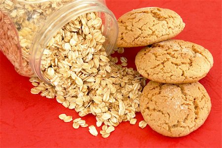 simsearch:400-06462101,k - three fresh appetizing oatmeal cookies over red background Stock Photo - Budget Royalty-Free & Subscription, Code: 400-05675571