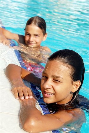 pools interior exterior - smiling girl and boy in blue swimming pool portrait Stock Photo - Budget Royalty-Free & Subscription, Code: 400-05676354