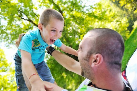 family father and son have fun at park on summer season and representing happines concept Stock Photo - Budget Royalty-Free & Subscription, Code: 400-05676364