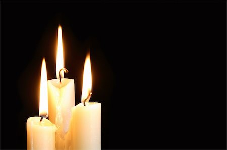 simsearch:400-04210315,k - Three ordinary lighting candles on black background with free space for your text Stock Photo - Budget Royalty-Free & Subscription, Code: 400-05676449
