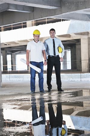 Team of business people in group, architect and engeneer  on construciton site check documents and business workflow on new building Stock Photo - Budget Royalty-Free & Subscription, Code: 400-05676814