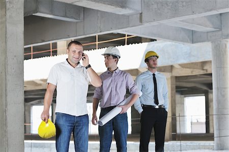 Team of business people in group, architect and engeneer  on construciton site check documents and business workflow on new building Stock Photo - Budget Royalty-Free & Subscription, Code: 400-05676815