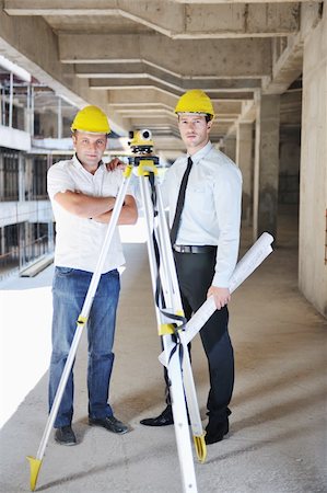 Team of business people in group, architect and engeneer  on construciton site check documents and business workflow on new building Stock Photo - Budget Royalty-Free & Subscription, Code: 400-05676810