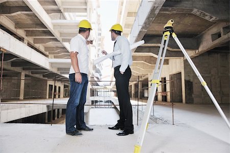Team of business people in group, architect and engeneer  on construciton site check documents and business workflow on new building Stock Photo - Budget Royalty-Free & Subscription, Code: 400-05676812