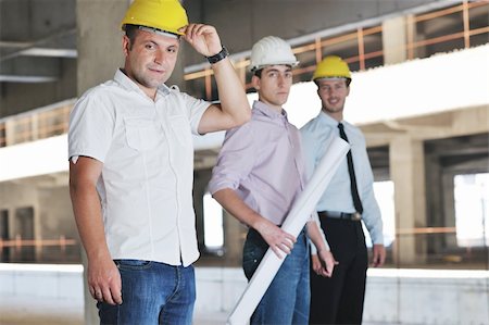 Team of business people in group, architect and engeneer  on construciton site check documents and business workflow on new building Stock Photo - Budget Royalty-Free & Subscription, Code: 400-05676824