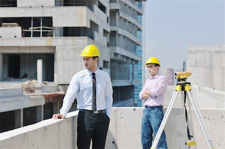 Team of business people in group, architect and engeneer  on construciton site check documents and business workflow on new building Stock Photo - Budget Royalty-Free & Subscription, Code: 400-05676839