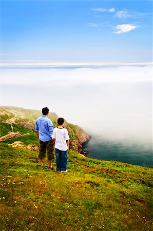 signal hill - Father and son looking at foggy ocean view in Newfoundland Photographie de stock - Aubaine LD & Abonnement, Code: 400-05677111