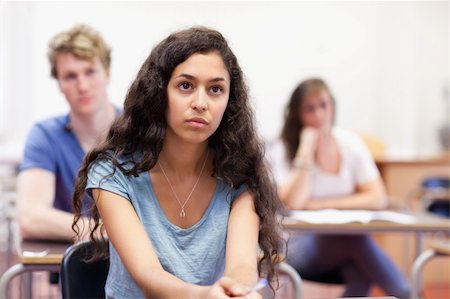 simsearch:400-05677834,k - Focused student listening in a classroom Photographie de stock - Aubaine LD & Abonnement, Code: 400-05677766