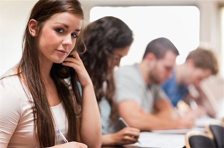 Good looking students listening a lecturer in an amphitheater Stock Photo - Budget Royalty-Free & Subscription, Code: 400-05677837