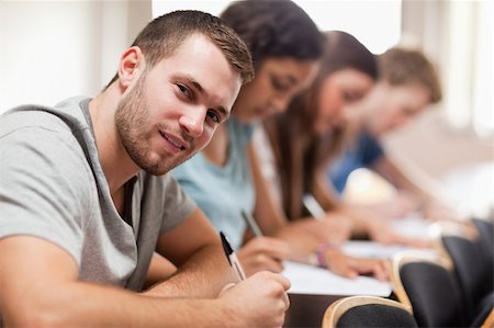 Students taking an exam in an amphitheater Stock Photo - Budget Royalty-Free & Subscription, Code: 400-05677831